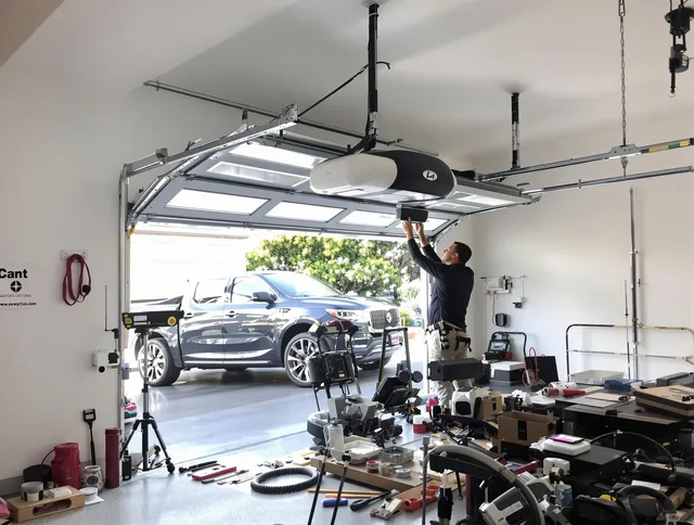 Chino Garage Door Repair specialist installing smart garage door opener system in Chino home